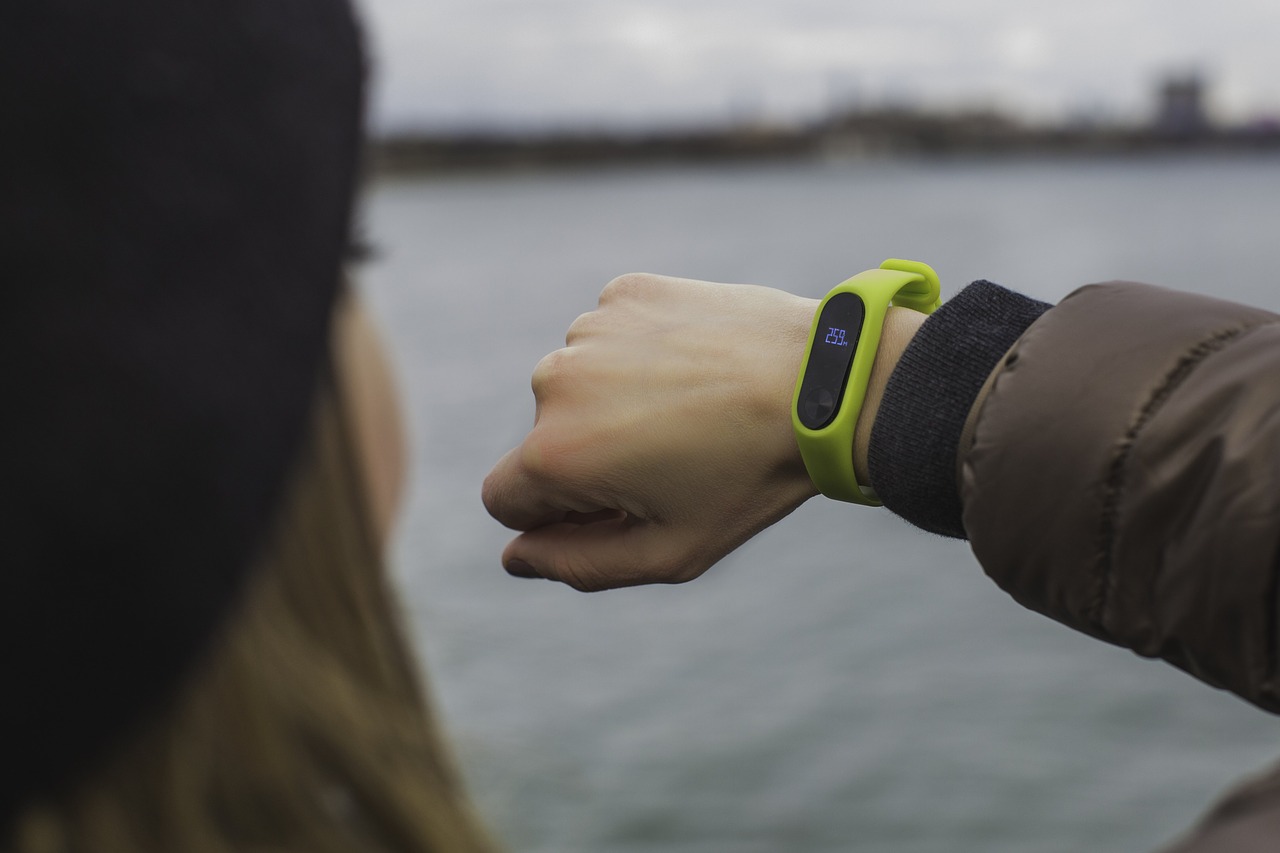 Woman looking at an activity tracker on her wrist