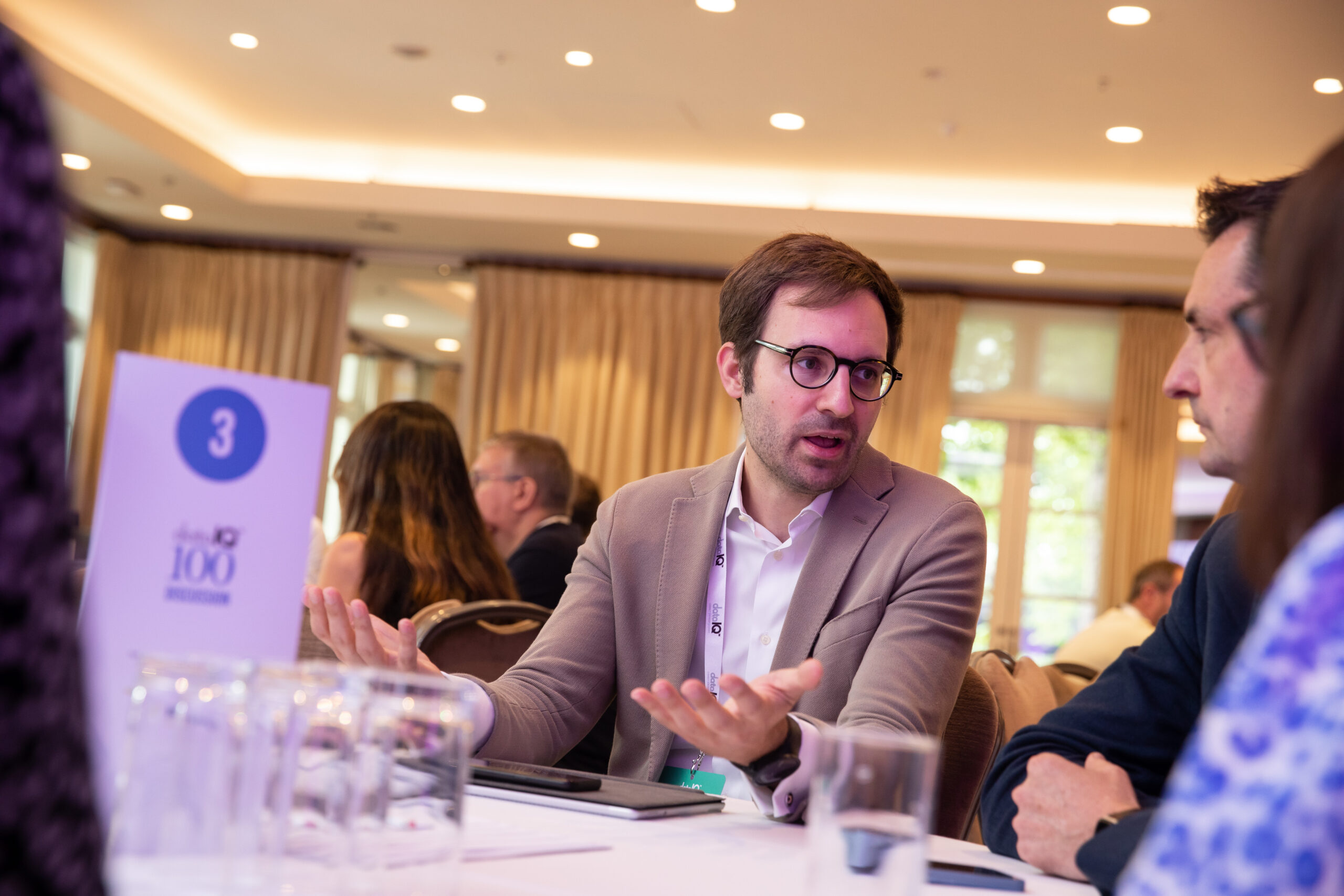 A member of DataIQ discussing genAI at a roundtable.