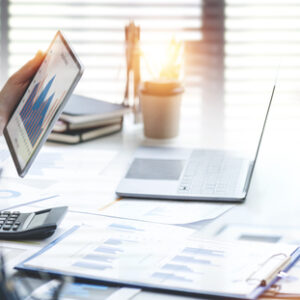 Business advisor, business people talking, planning analyze investment and marketing on tablet in office.