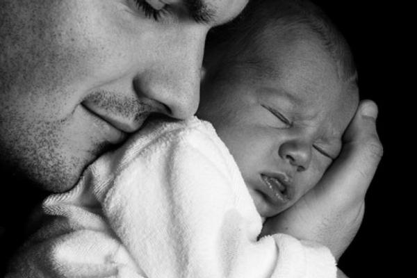 man holding a baby Thumb