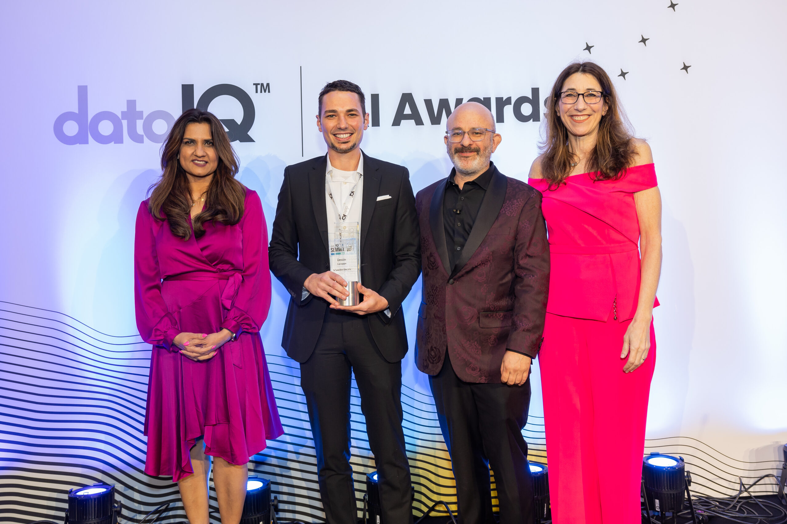 2024 DataIQ Data & AI Awards winners collecting their trophy.