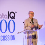 David Reed standing on stage discussing governance, such as the new Data Use and Access Bill.