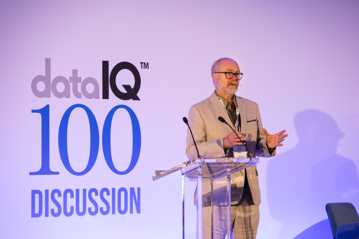 David Reed standing on stage discussing governance, such as the new Data Use and Access Bill.